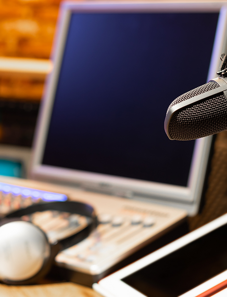laptop, headphone and microphone for audio production
