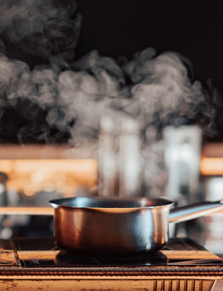 steam over cooking pot producing sounds